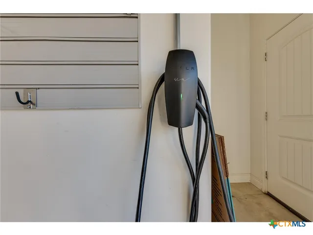 a white building with a yard in front of it