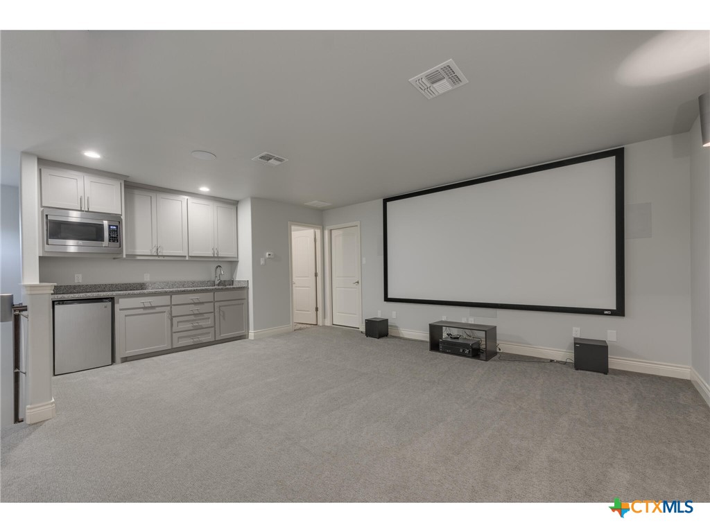 1729 Las Lomas Court Temple, TX 76502 - Photo 27 of 43 Upstairs theater with wet bar and half bath
