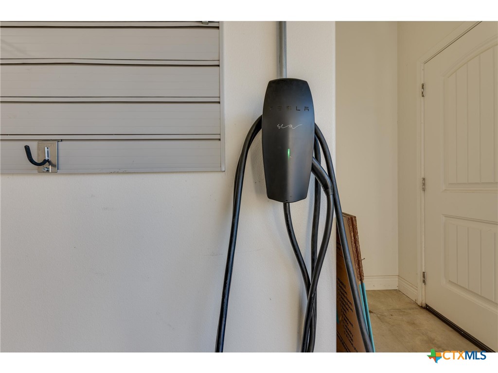 1729 Las Lomas Court Temple, TX 76502 - Photo 32 of 43 Tesla EV wall connector charge at home
