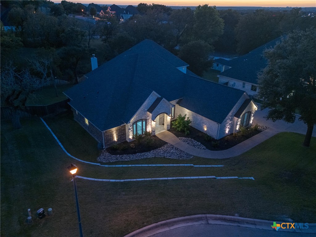 1729 Las Lomas Court Temple, TX 76502 - Photo 40 of 43 Front elevation with warm evening lighting and landscaping