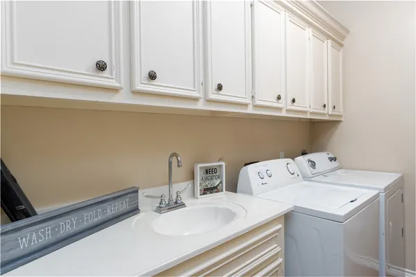 a bathroom with a sink and cabinets