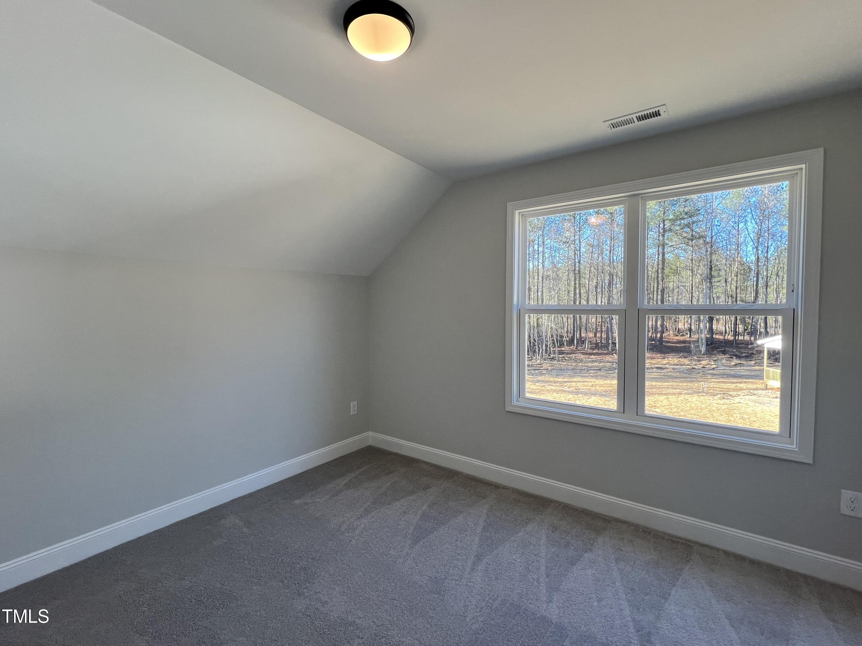 117 Isaac Lane Wendell, NC 27591 - Photo 11 of 16 an empty room with a window