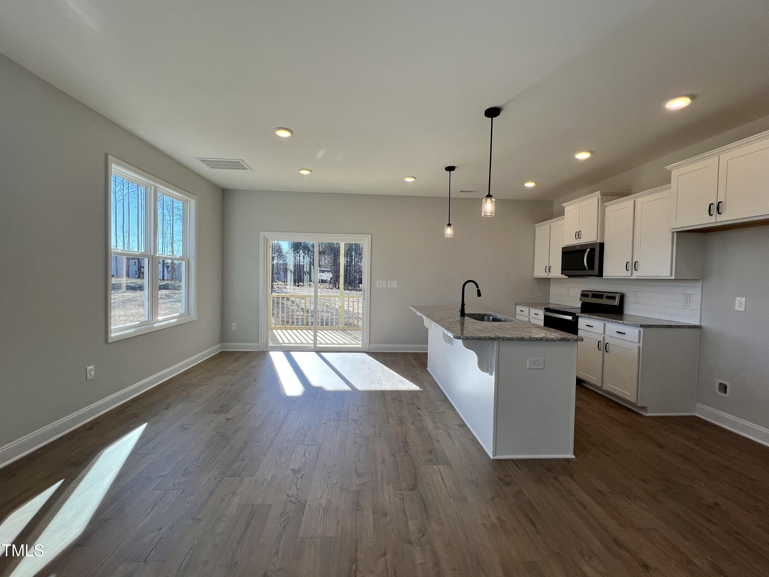 117 Isaac Lane Wendell, NC 27591 - Photo 4 of 16 a view of kitchen with cabinets and wooden floor