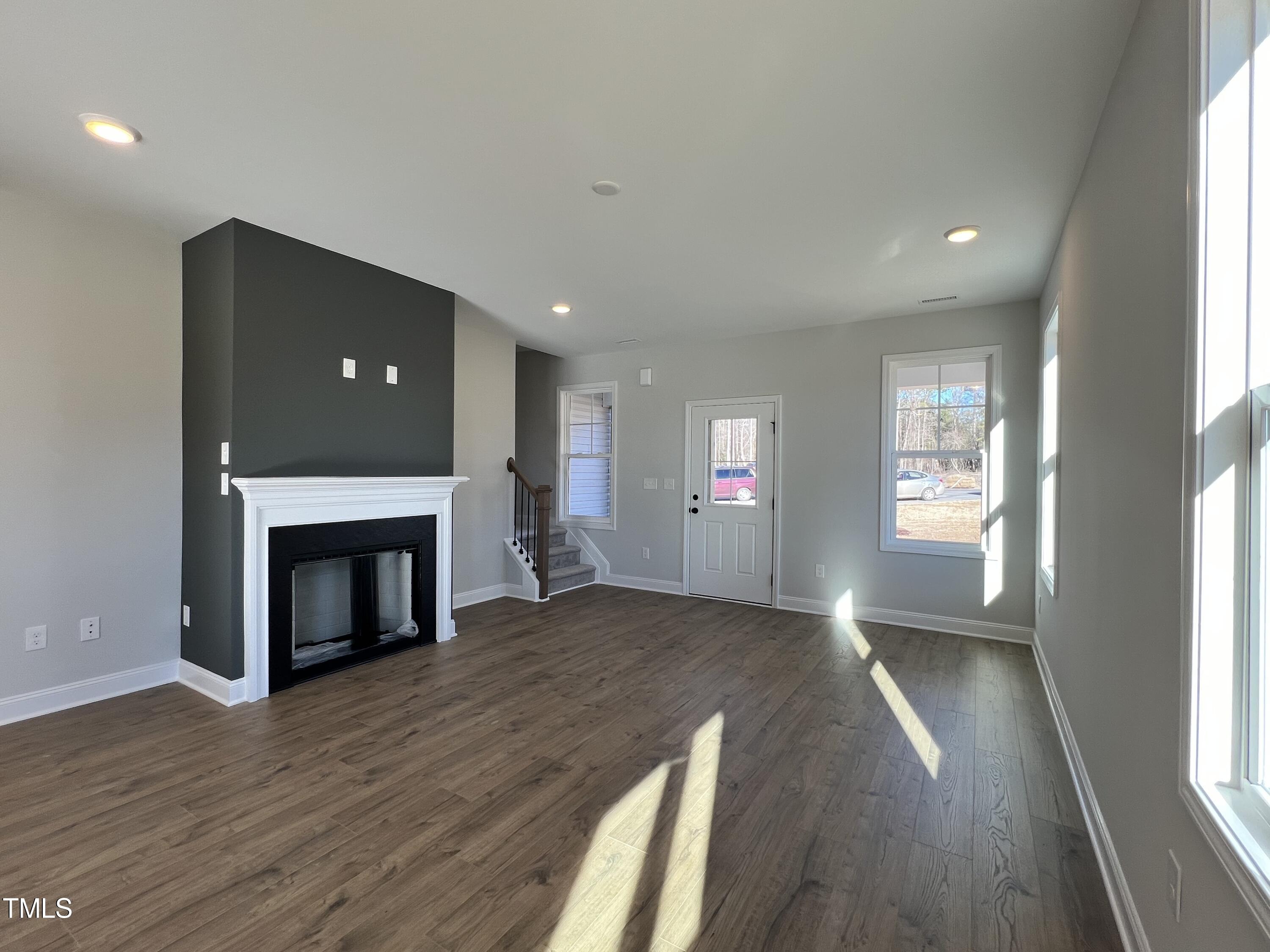 117 Isaac Lane Wendell, NC 27591 - Photo 6 of 16 a view of an empty room with window and fire place