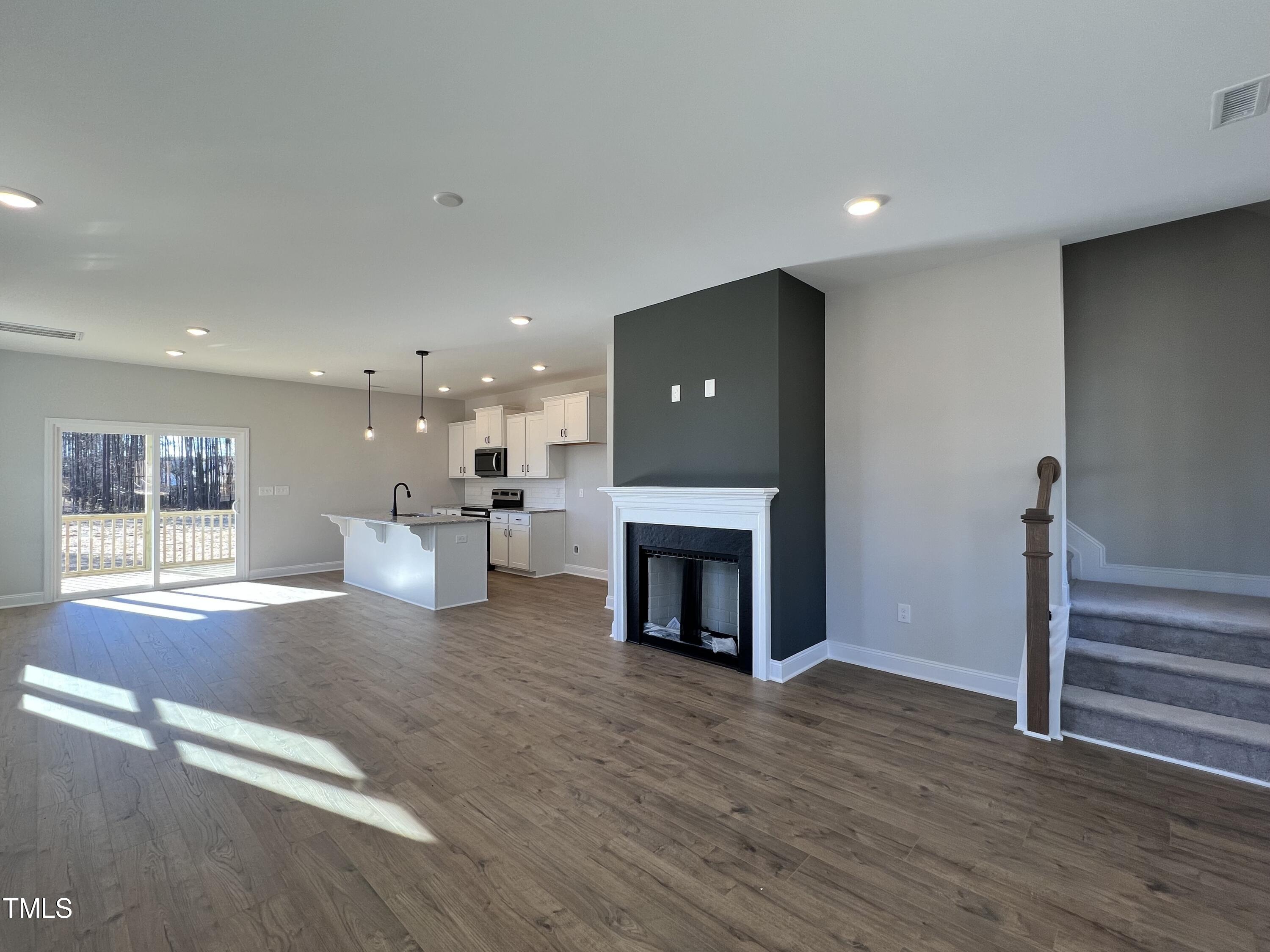 117 Isaac Lane Wendell, NC 27591 - Photo 7 of 16 a view of a livingroom with a fireplace and window