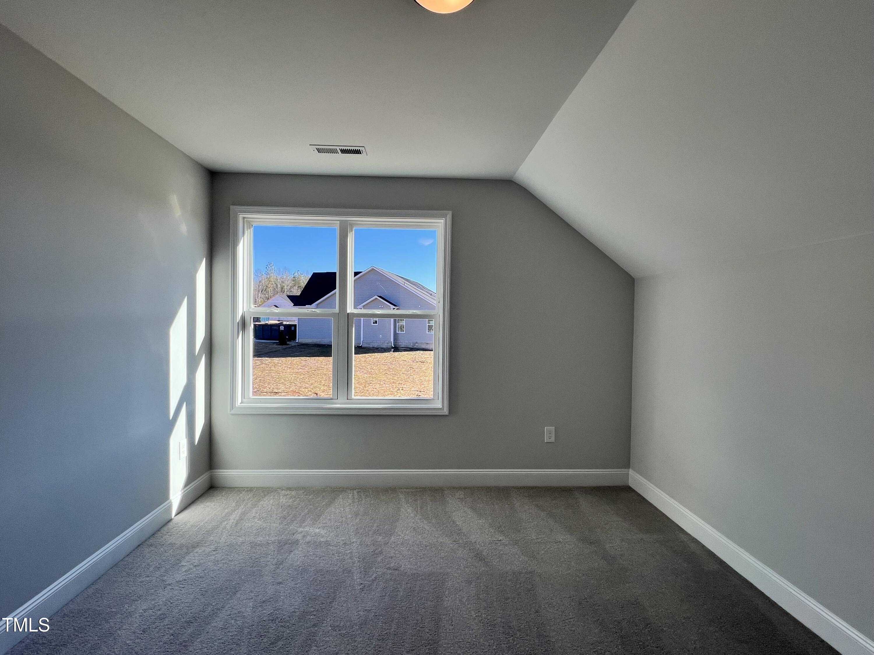 117 Isaac Lane Wendell, NC 27591 - Photo 10 of 16 an empty room with a window