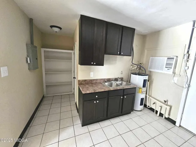 a kitchen with stainless steel appliances a stove and a refrigerator