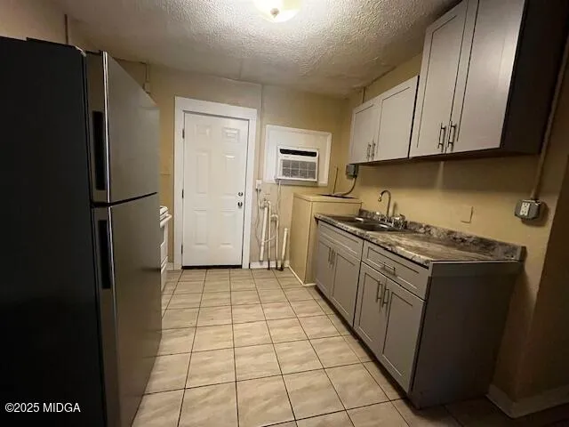 a kitchen with a refrigerator stove and cabinets