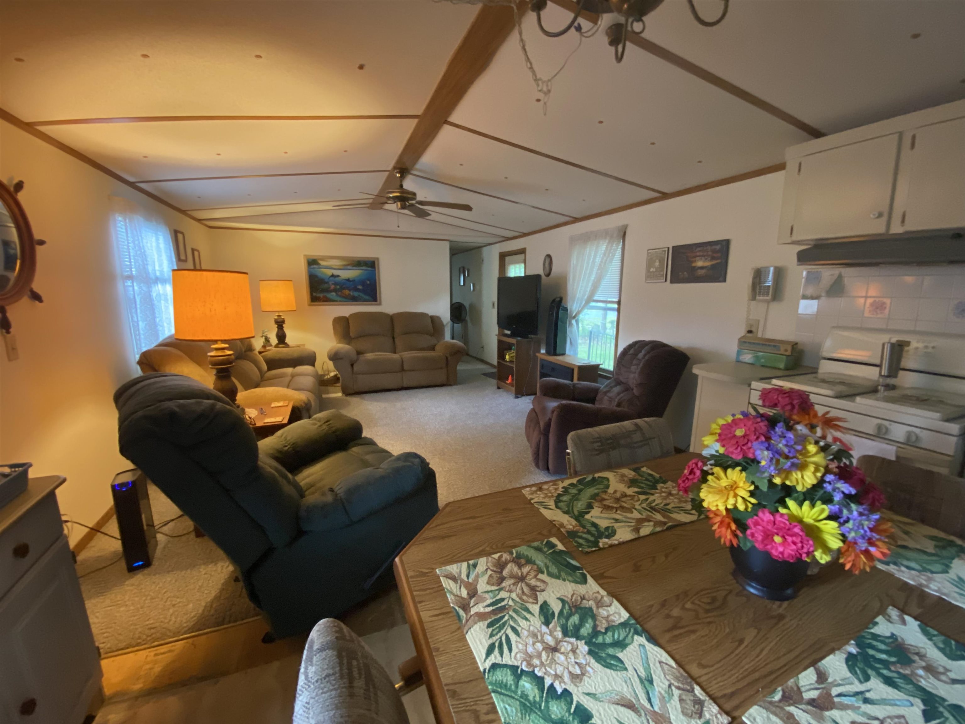829 Oakes Avenue St. Augustine, FL 32084 - Photo 6 of 10 a living room with furniture chess board and flat screen tv