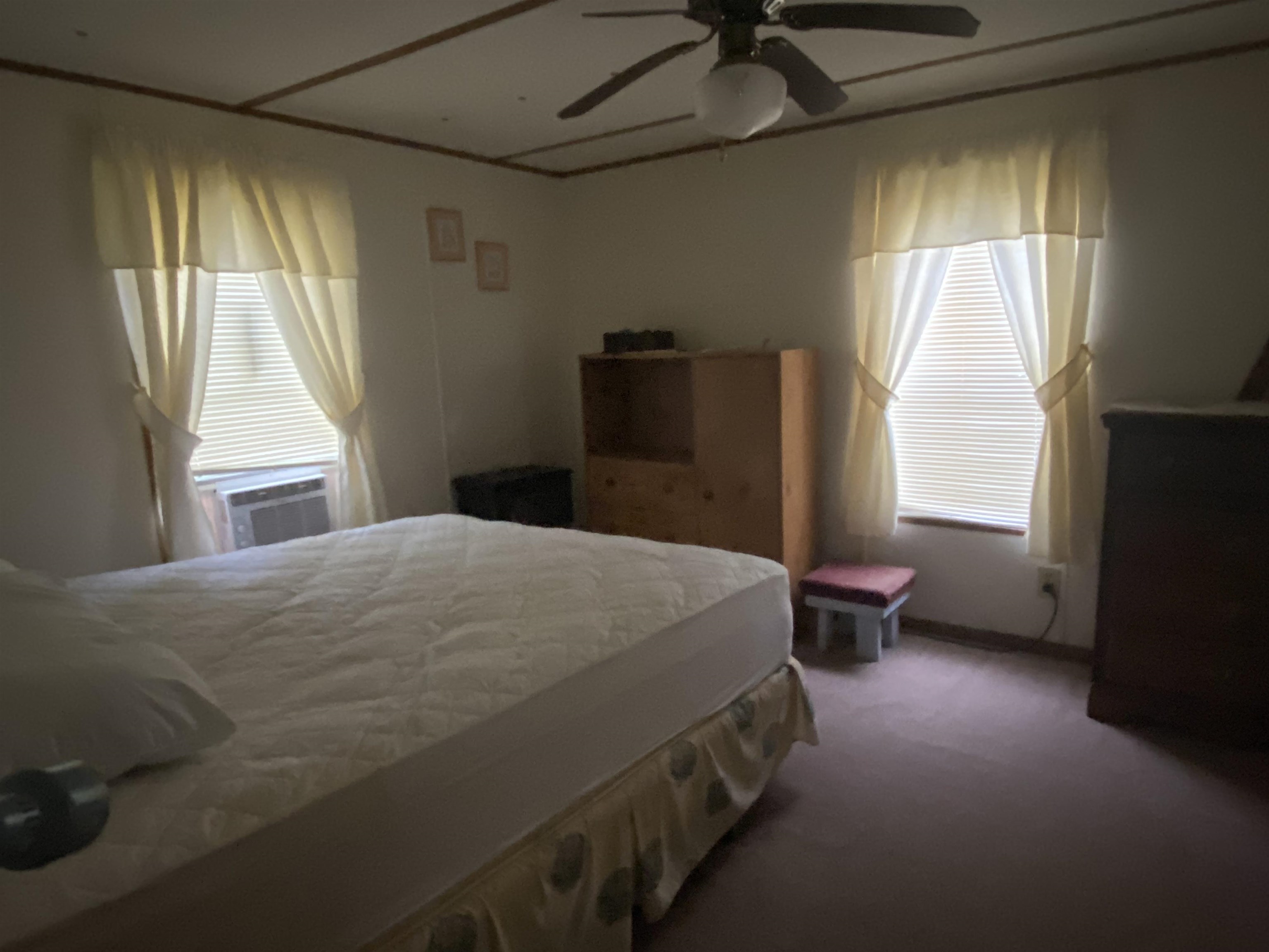 829 Oakes Avenue St. Augustine, FL 32084 - Photo 7 of 10 a bedroom with a bed and a window