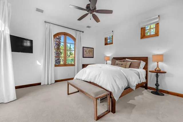 a view of a lake with couches and city view