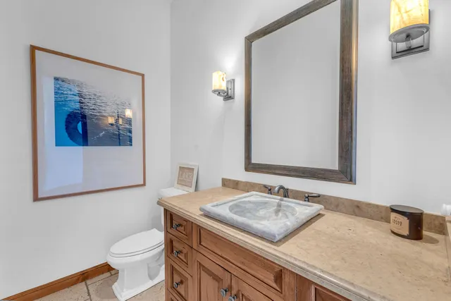 a kitchen with a refrigerator a stove and a sink