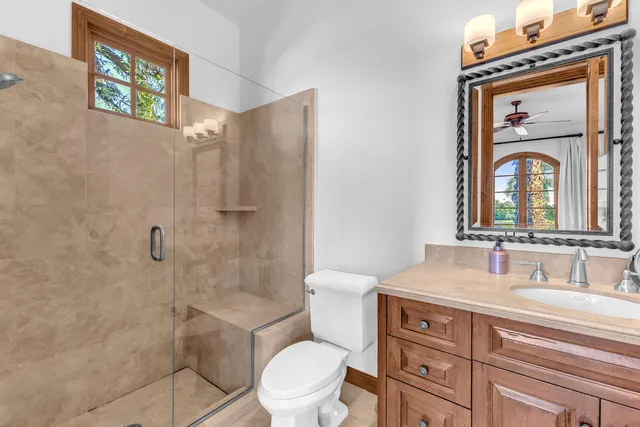 a kitchen with granite countertop a stove top oven cabinetry and granite counter tops