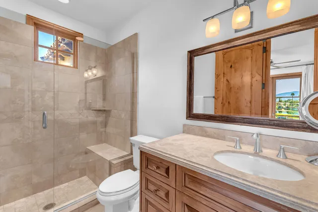 a bedroom with a bed and a lamp