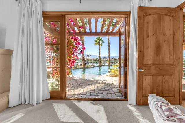 a view of swimming pool with a lounge chair