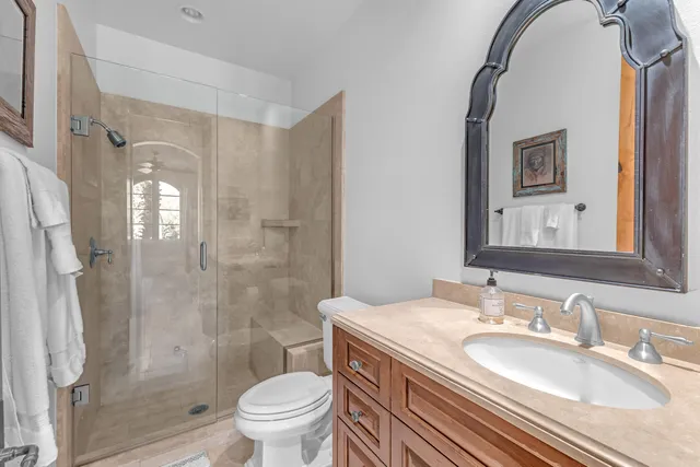 a bathroom with a tub a sink and a shower