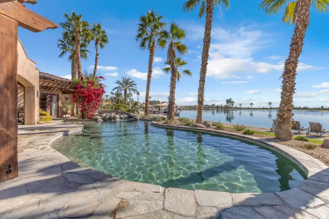 a view of a lake with houses in the background