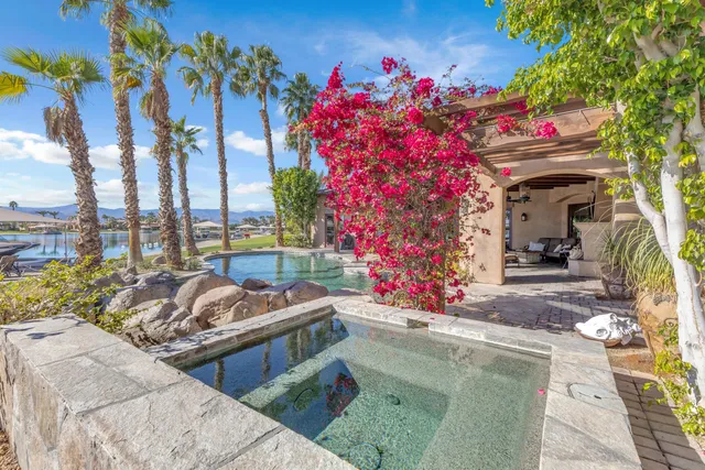 a view of a backyard with sitting area