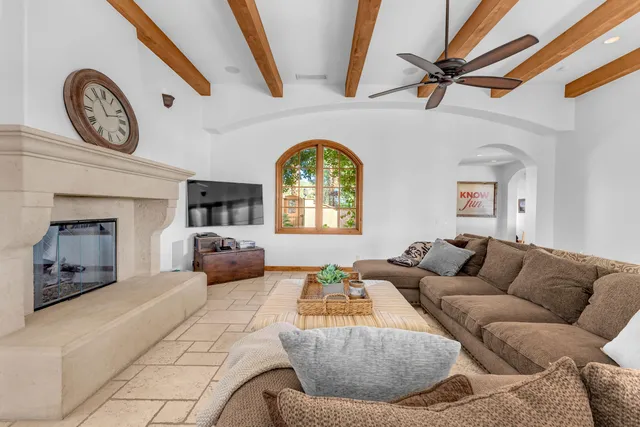 a view of a dining room with furniture a chandelier and wooden floor