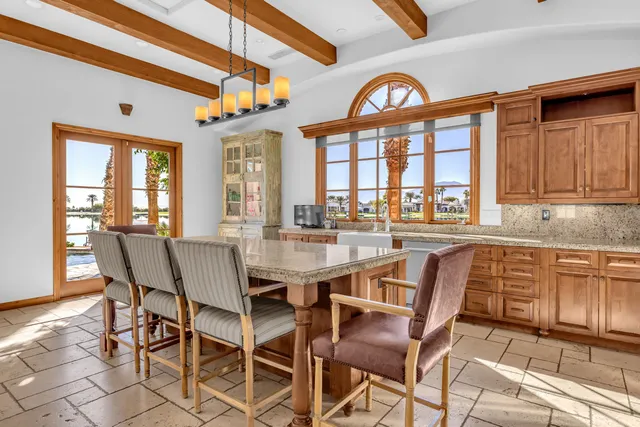 a large bed sitting in a bedroom next to a window