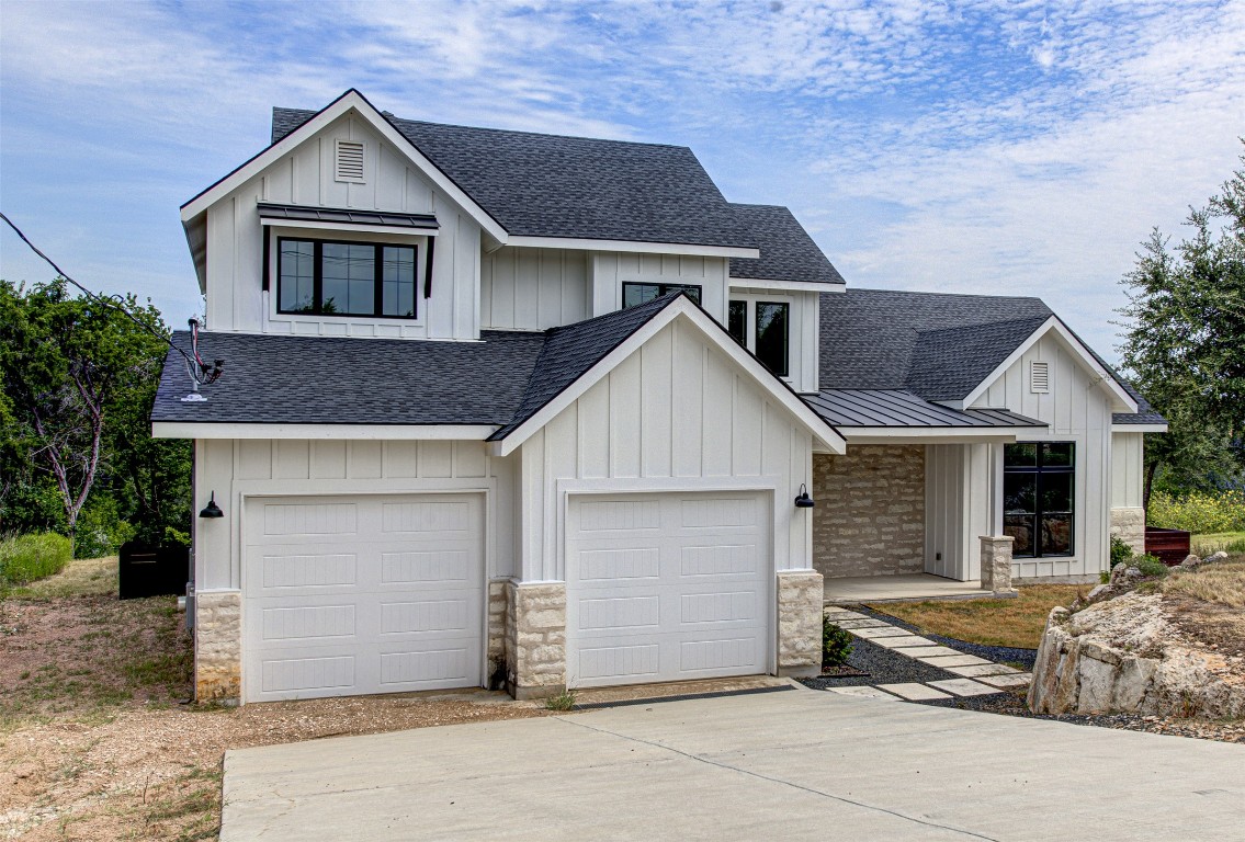 a front view of a house with a garage