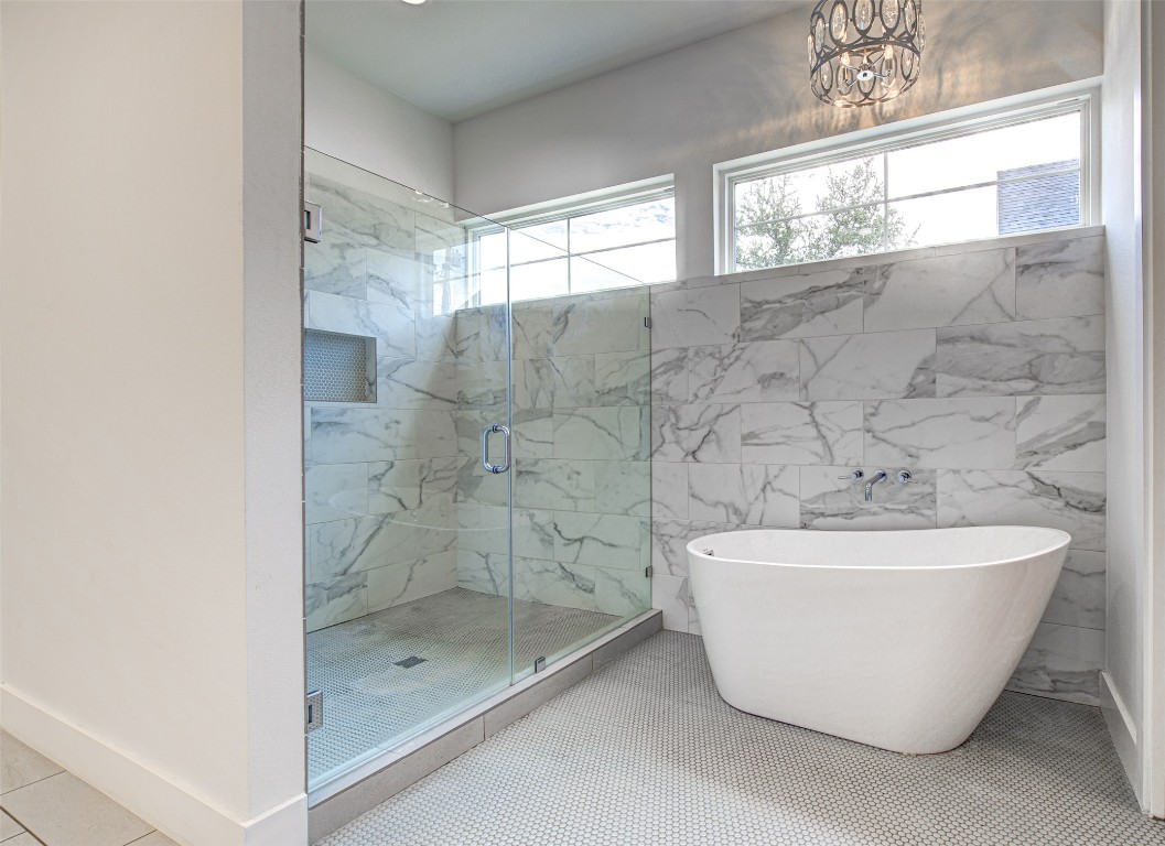 14210 Fort Smith Trail Austin, TX 78734 - Photo 20 of 37 a bathroom with a bathtub and shower