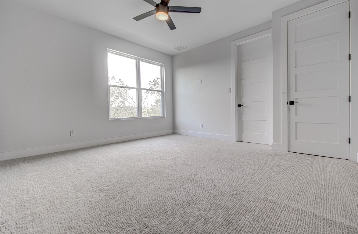14210 Fort Smith Trail Austin, TX 78734 - Photo 31 of 37 a view of a livingroom with a ceiling fan and window