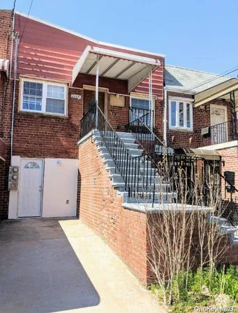 a front view of a house with glass windows