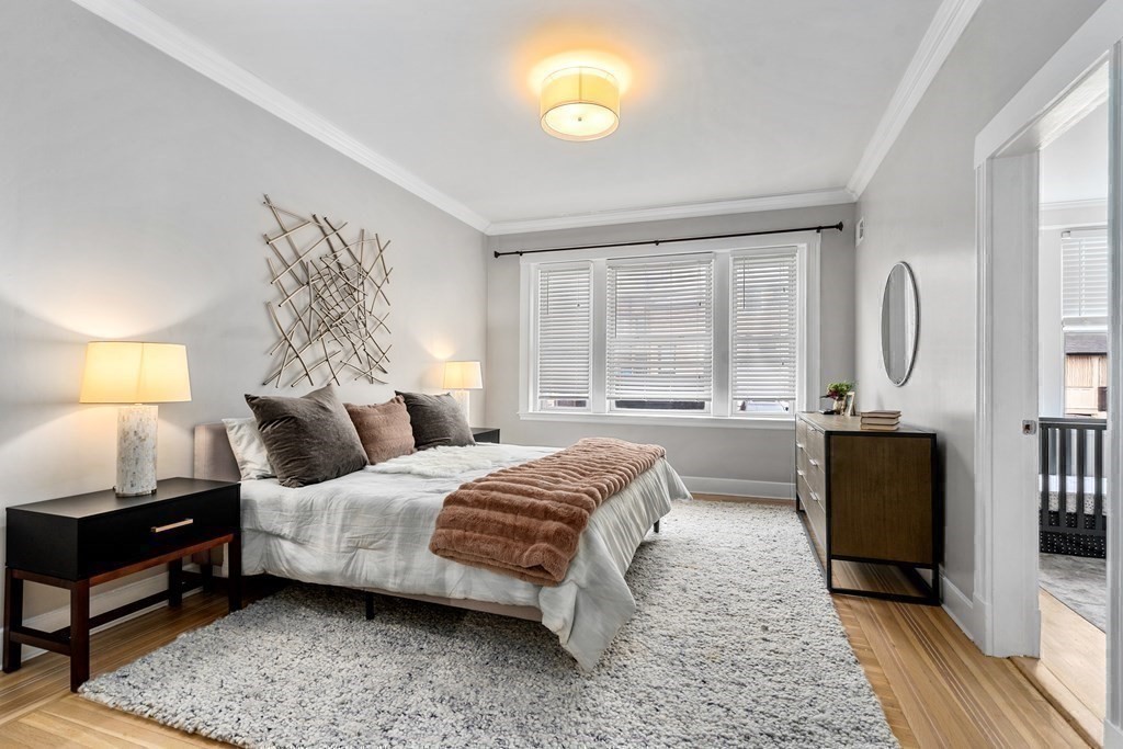 14 Warwick Road, Unit 1 Brookline, MA 02445 - Photo 12 of 29 a bedroom with a bed and a window