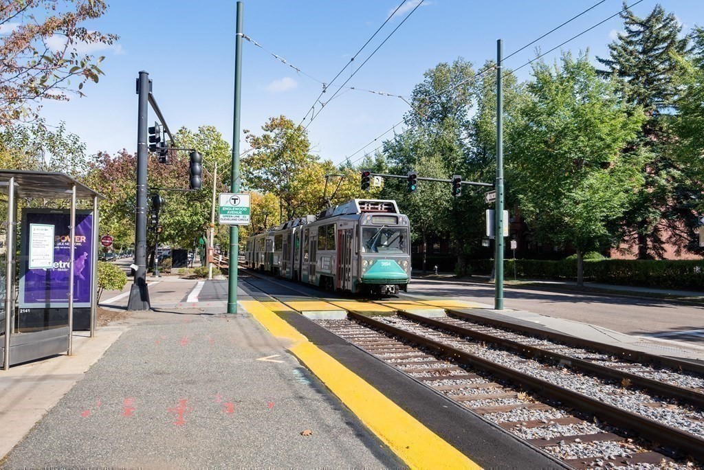 14 Warwick Road, Unit 1 Brookline, MA 02445 - Photo 21 of 29 a view of a park with swings and slides