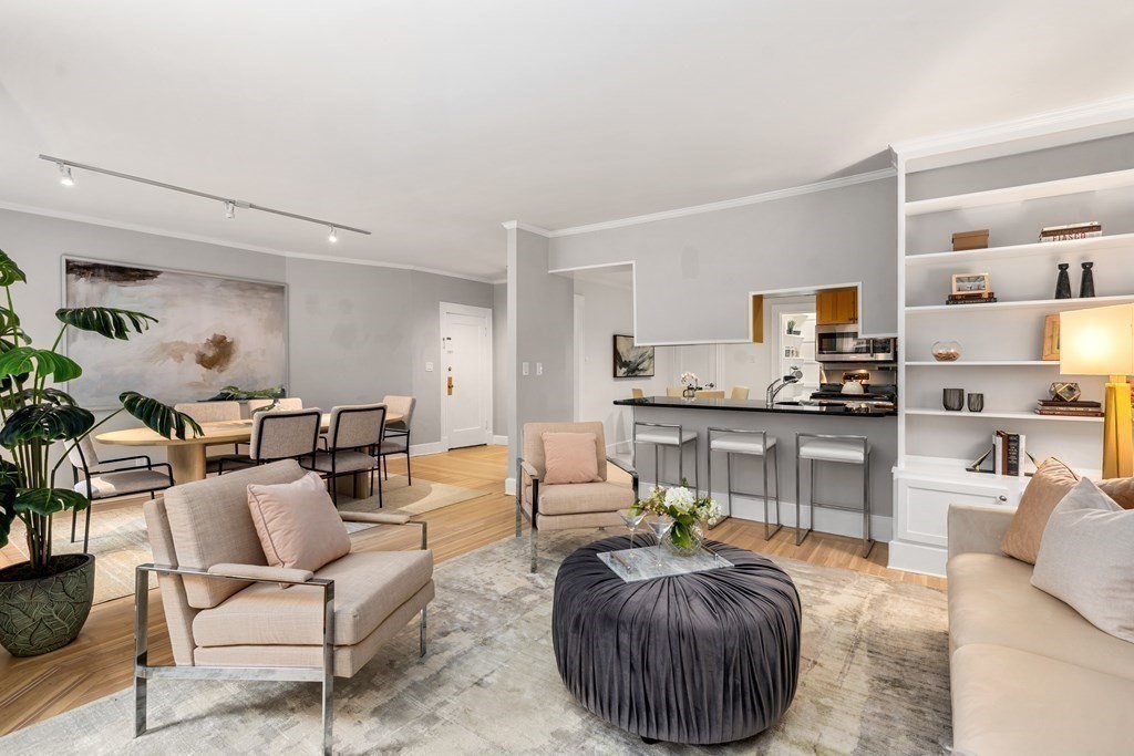 14 Warwick Road, Unit 1 Brookline, MA 02445 - Photo 3 of 29 a living room with furniture and a wooden floor