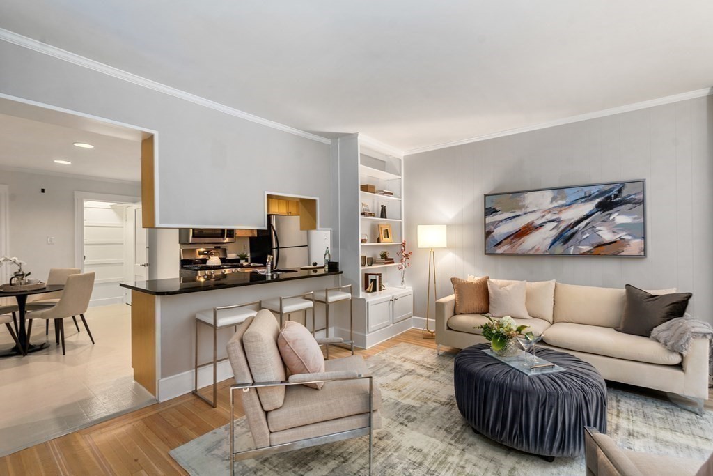 14 Warwick Road, Unit 1 Brookline, MA 02445 - Photo 6 of 29 a living room with furniture a couch and a flat screen tv