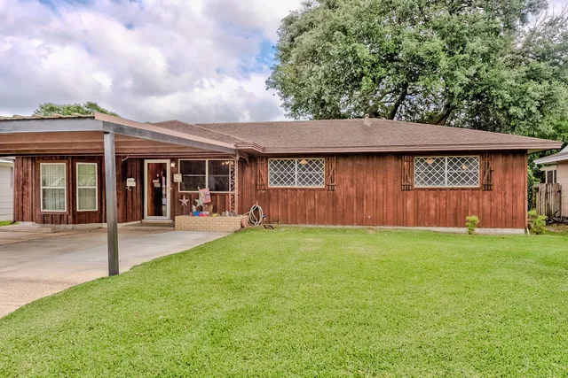 front view of a house with a yard