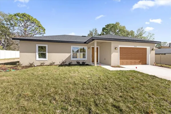 front view of a house with a yard
