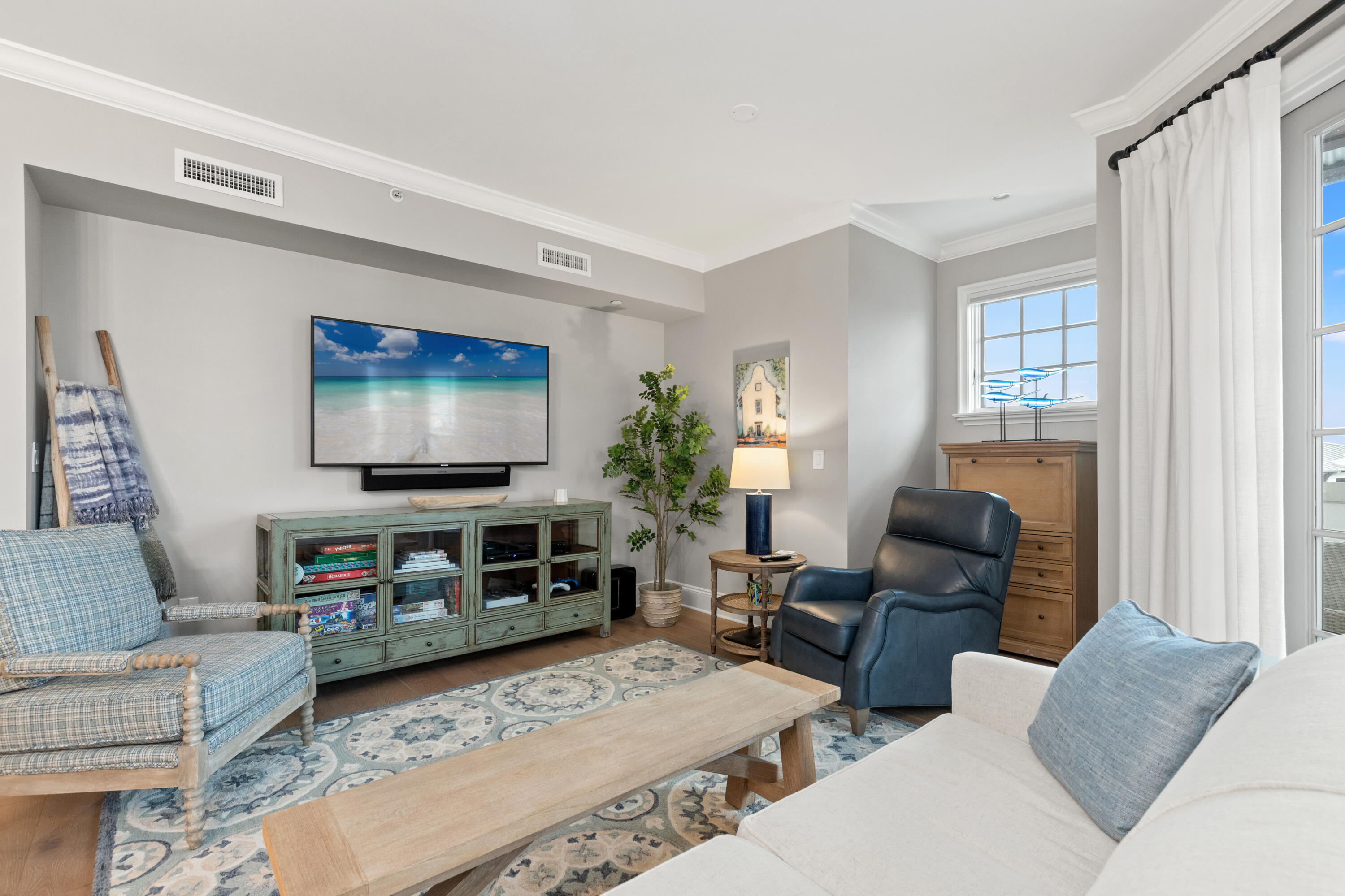 46 North Barrett Square, Unit 401 Inlet Beach, FL 32461 - Photo 14 of 34 a living room with furniture and a flat screen tv