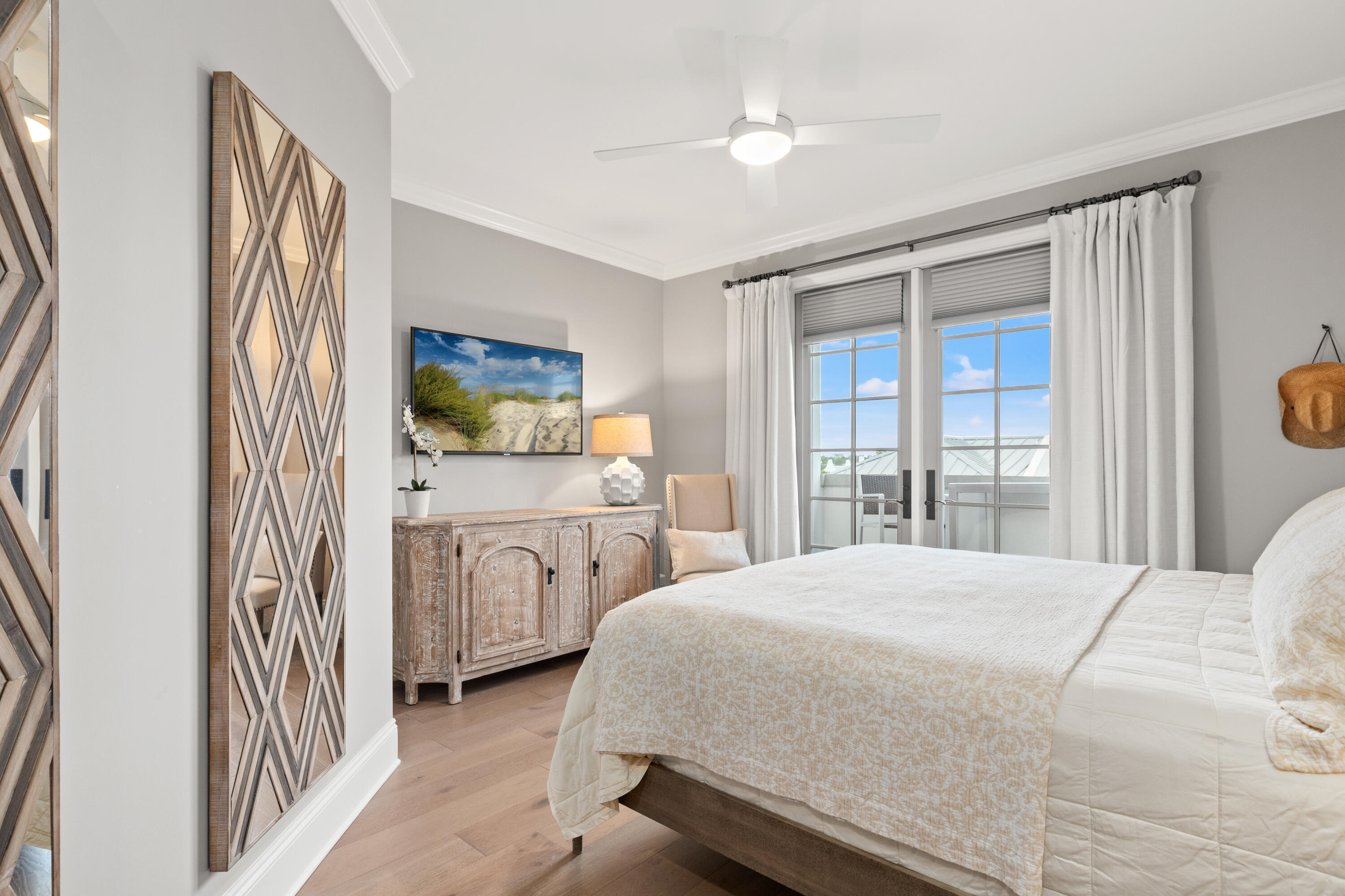 46 North Barrett Square, Unit 401 Inlet Beach, FL 32461 - Photo 5 of 34 a bedroom with a large bed and a window