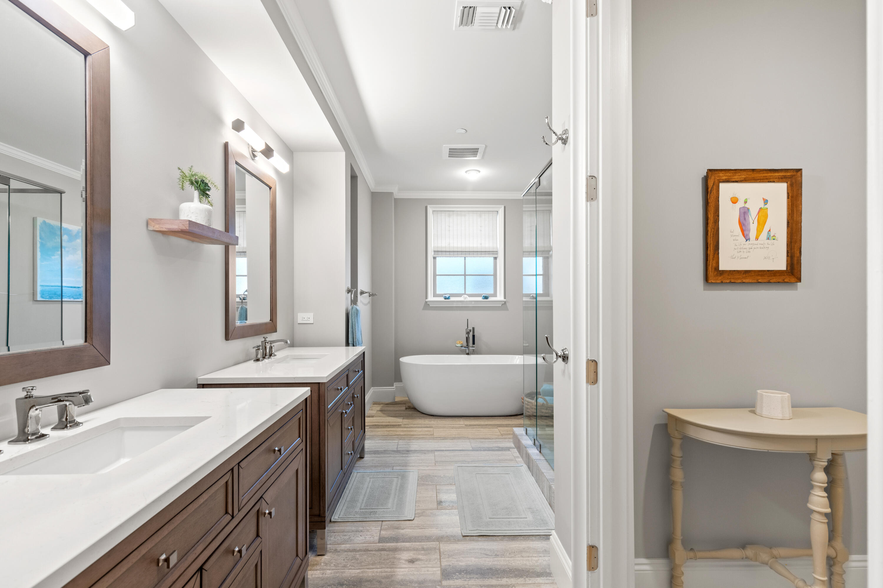 46 North Barrett Square, Unit 401 Inlet Beach, FL 32461 - Photo 6 of 34 a spacious bathroom with a double vanity sink a large mirror and a bathtub
