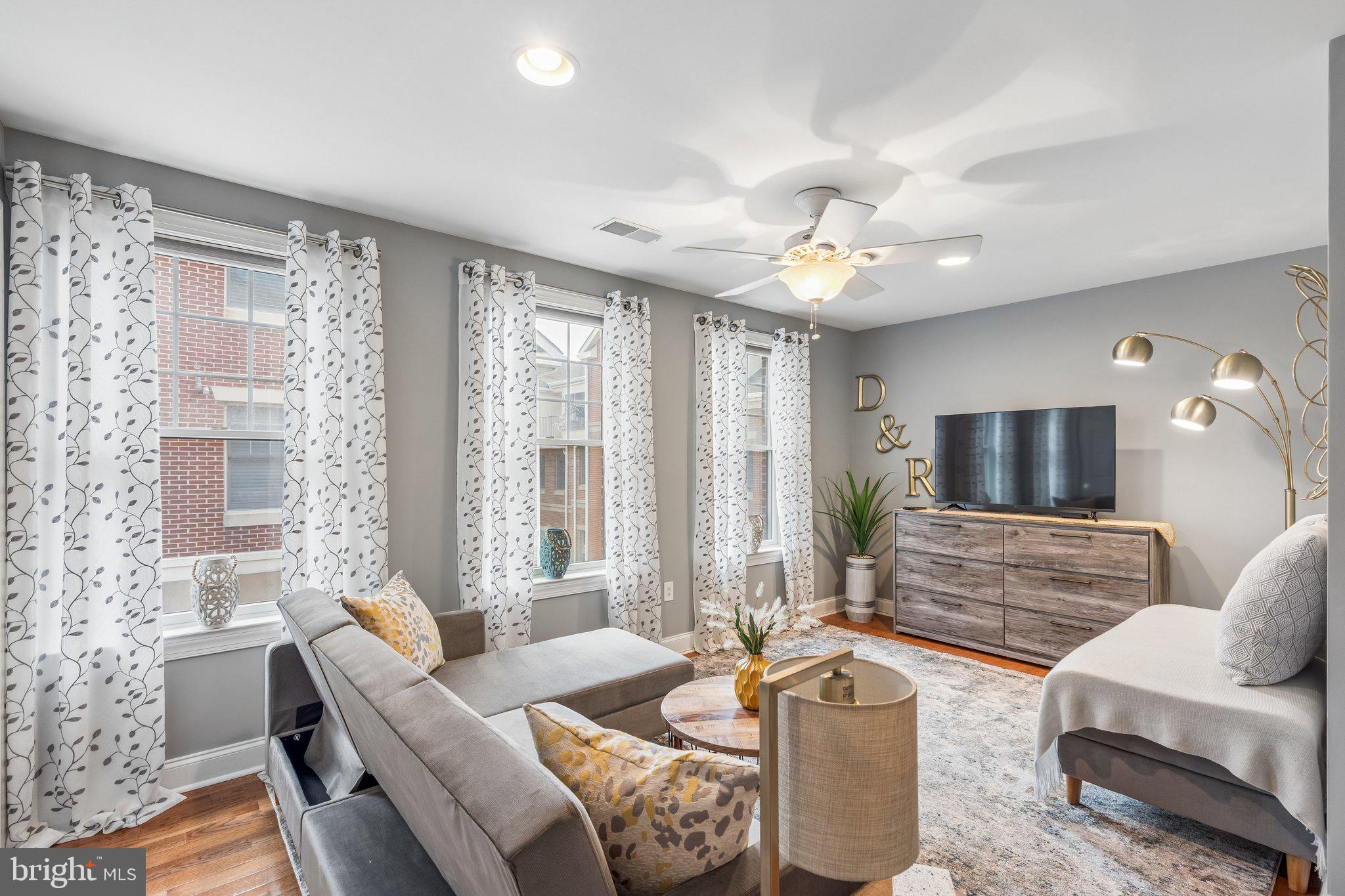852 Independence Court Philadelphia, PA 19147 - Photo 20 of 31 a living room with furniture and a flat screen tv
