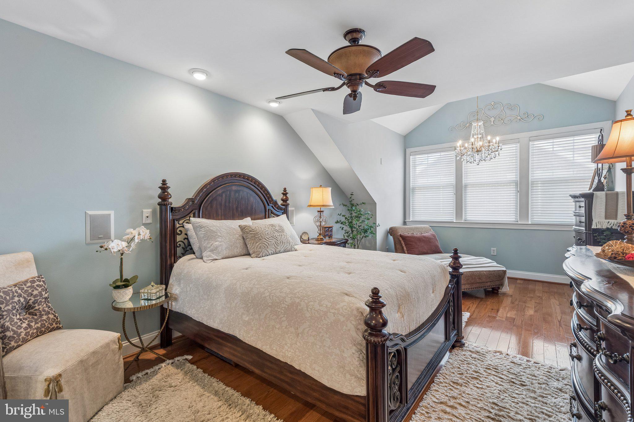 852 Independence Court Philadelphia, PA 19147 - Photo 25 of 31 a bed room with a bed and a chandelier