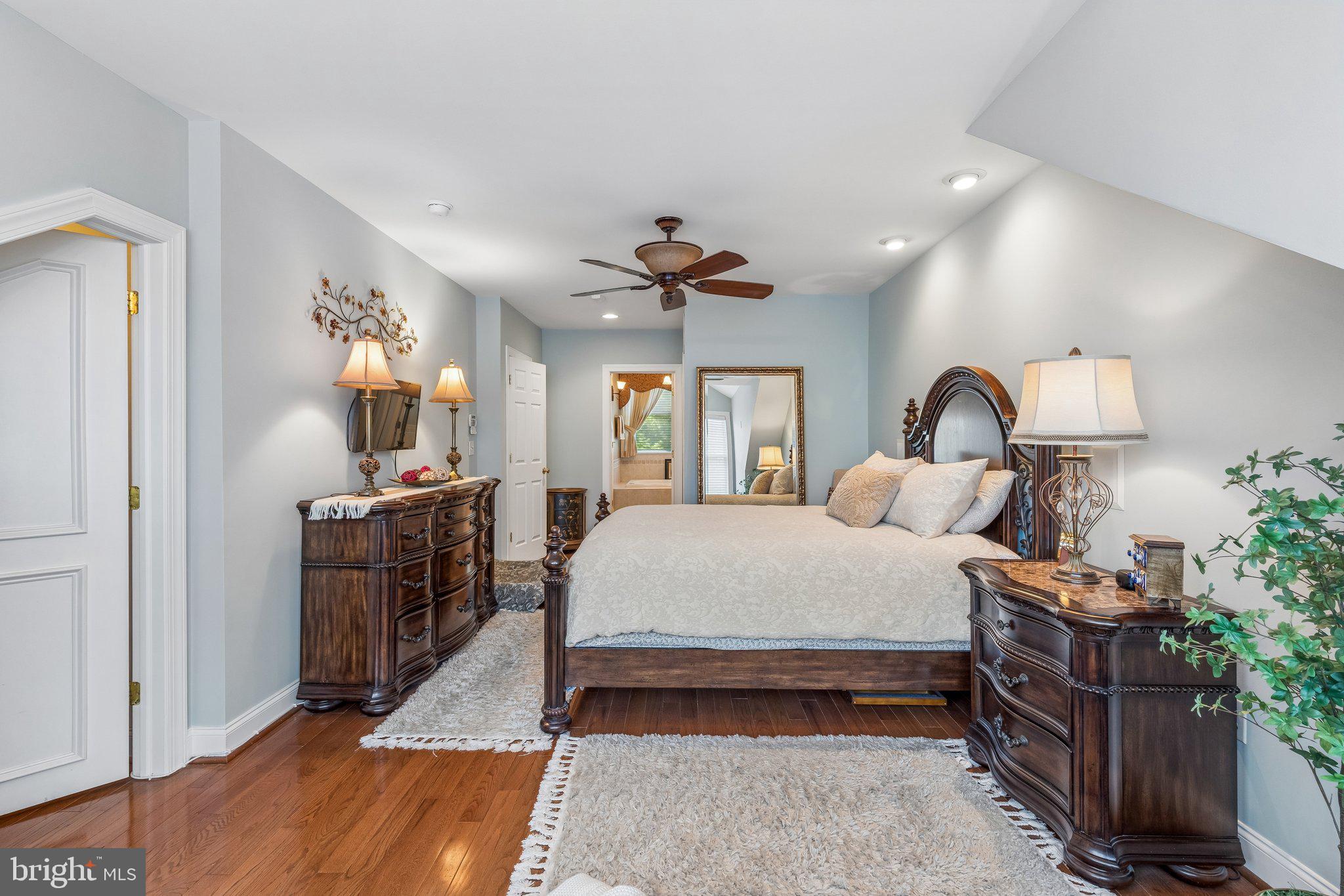 852 Independence Court Philadelphia, PA 19147 - Photo 26 of 31 a bed room with a bed and a chandelier