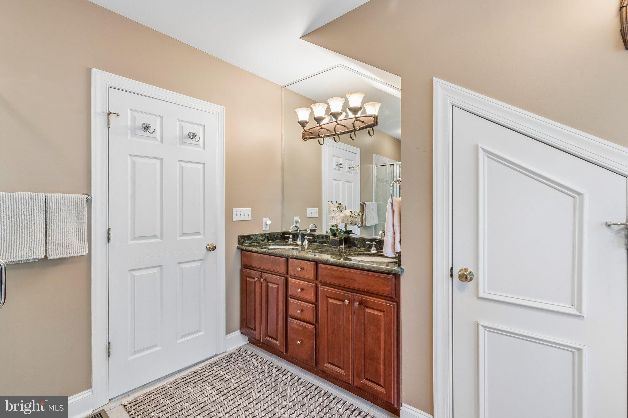 852 Independence Court Philadelphia, PA 19147 - Photo 28 of 31 a spacious bathroom with a granite countertop sink a mirror and a shower