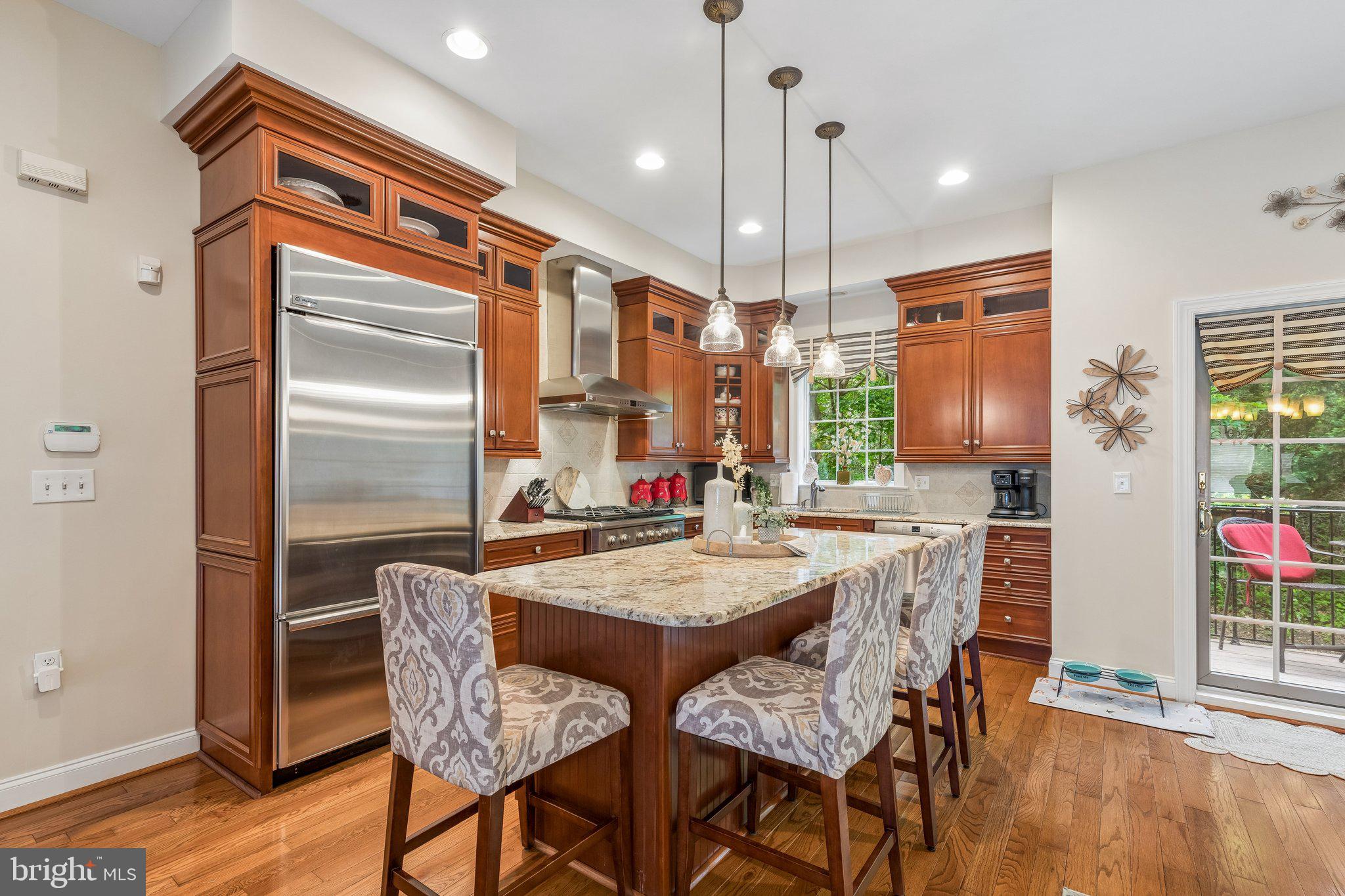 852 Independence Court Philadelphia, PA 19147 - Photo 8 of 31 a dining room with stainless steel appliances granite countertop furniture wooden floor and a chandelier