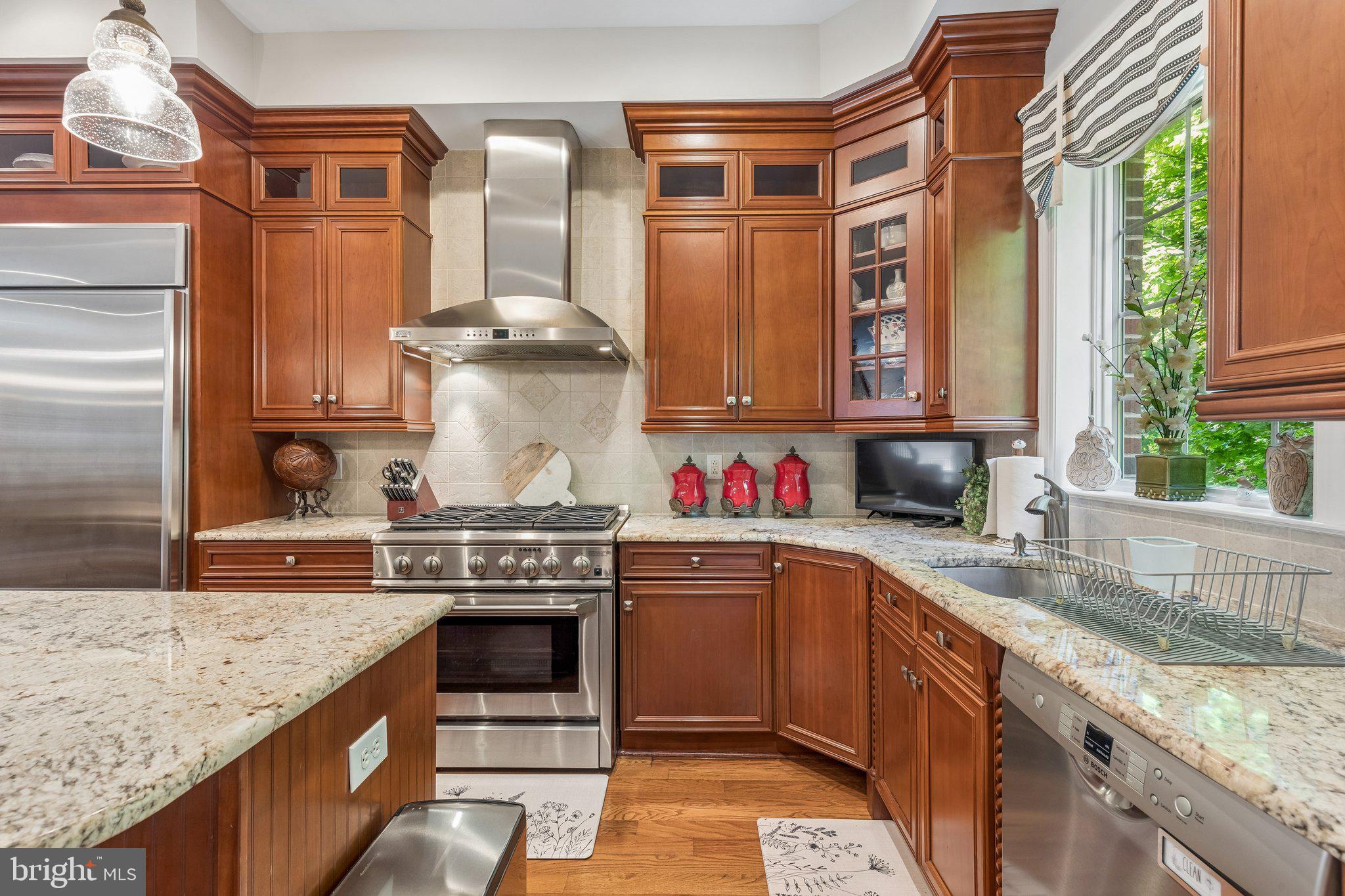 852 Independence Court Philadelphia, PA 19147 - Photo 9 of 31 a kitchen with stainless steel appliances granite countertop a stove and a sink