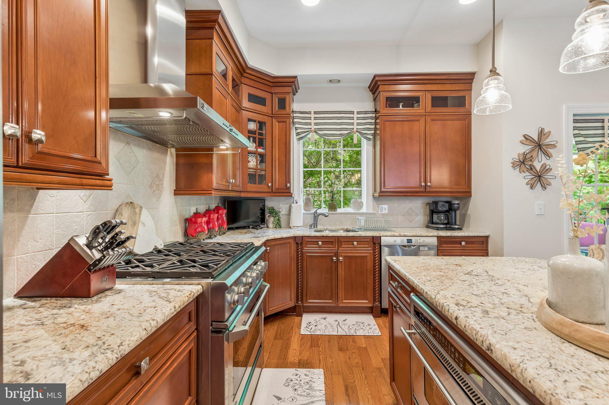 852 Independence Court Philadelphia, PA 19147 - Photo 10 of 31 a kitchen with stainless steel appliances granite countertop a stove a sink and a microwave