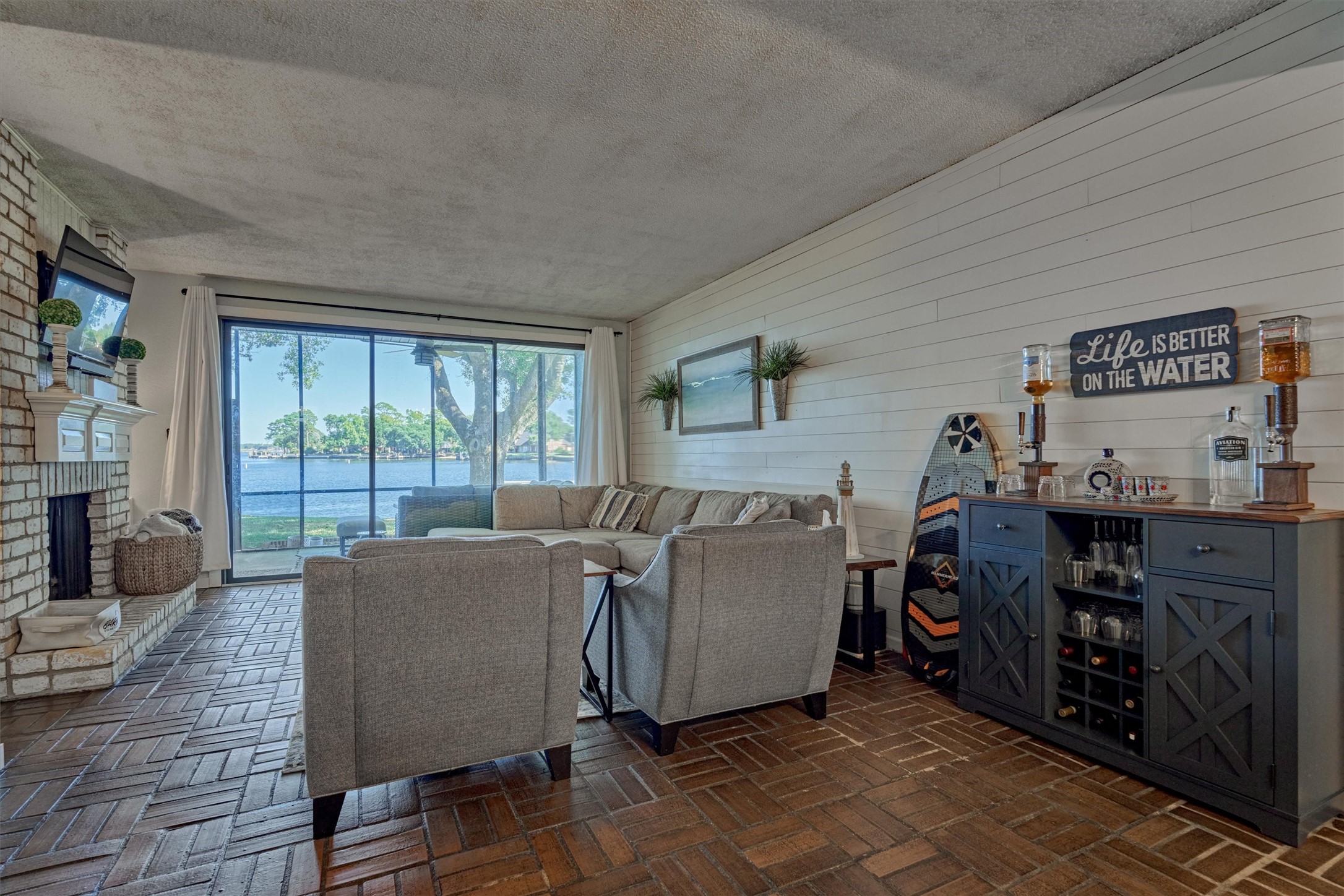 1428 Bowsprit Point Willis, TX 77318 - Photo 15 of 47 a living room with furniture and a floor to ceiling window
