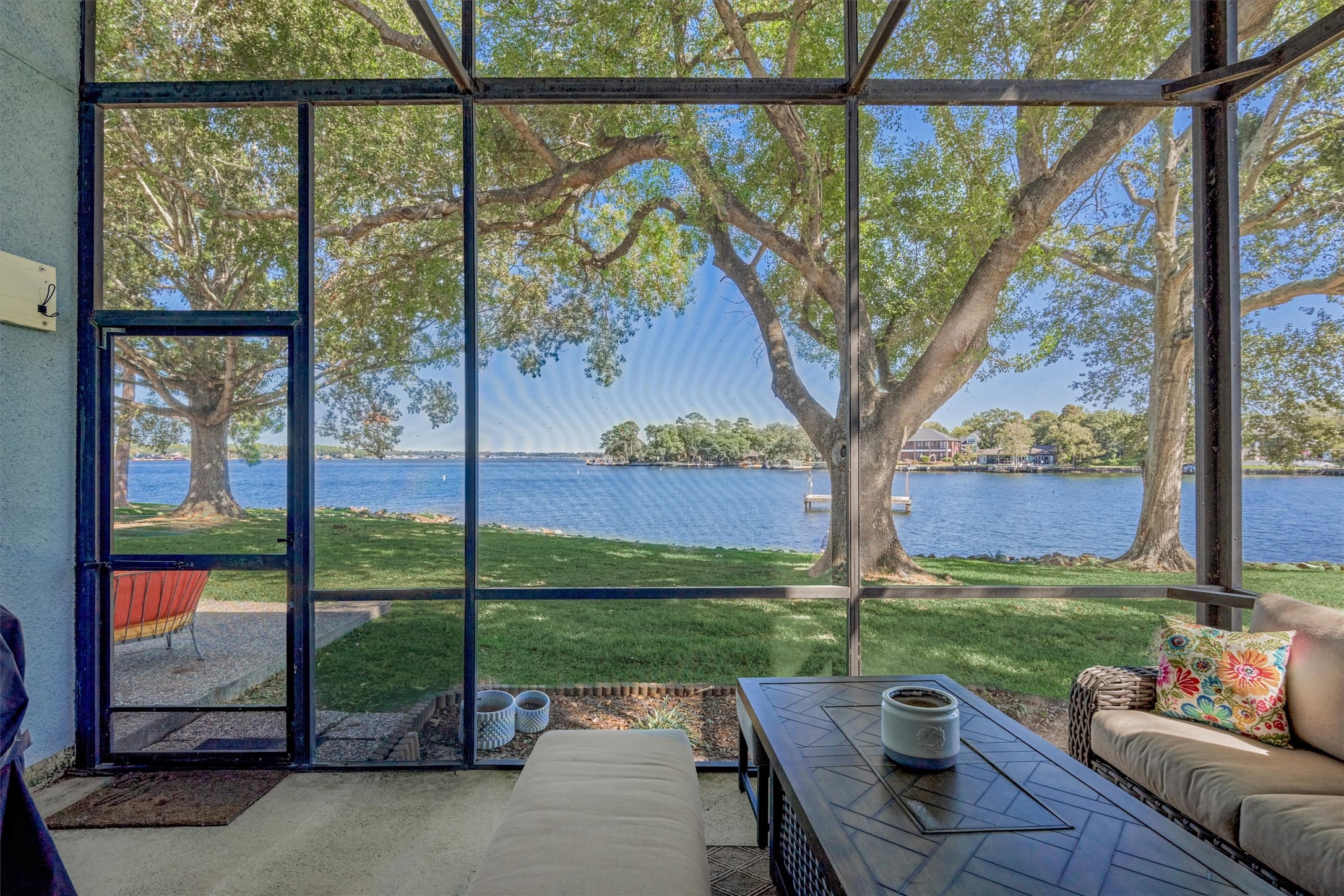 1428 Bowsprit Point Willis, TX 77318 - Photo 21 of 47 a view of a patio with couches plants and large trees