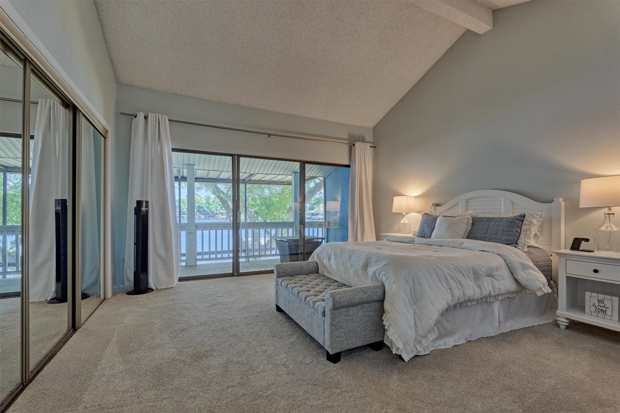 1428 Bowsprit Point Willis, TX 77318 - Photo 25 of 47 a spacious bedroom with a bed and a large window