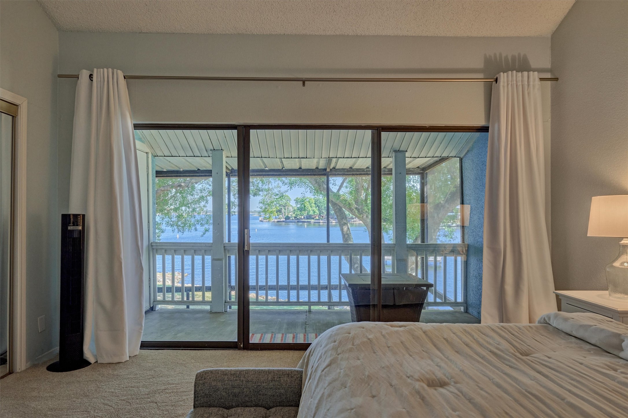 1428 Bowsprit Point Willis, TX 77318 - Photo 26 of 47 a bedroom with a bed and a large window