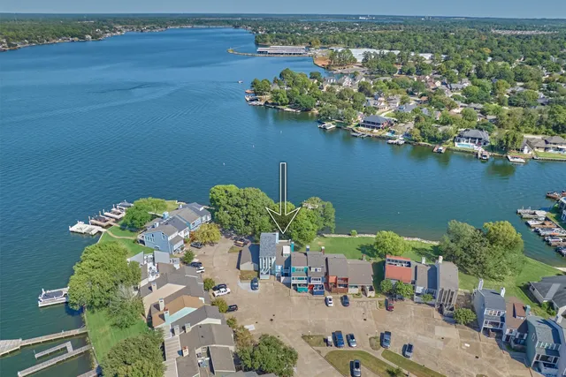 an aerial view of a house with a lake view