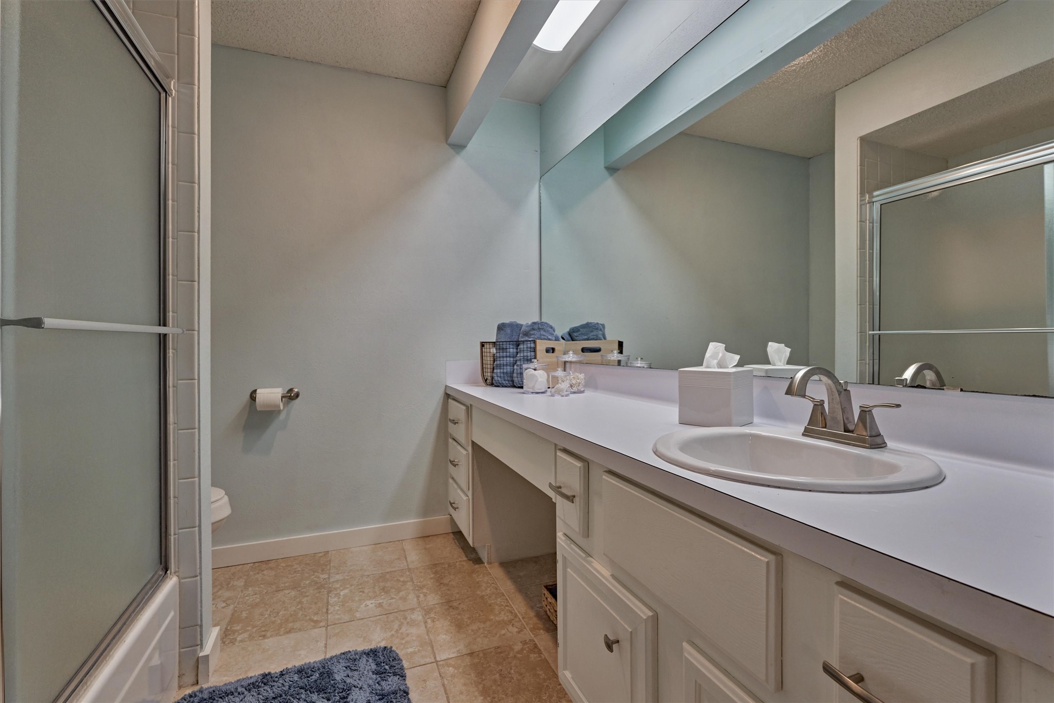 1428 Bowsprit Point Willis, TX 77318 - Photo 34 of 47 a bathroom with a sink and a mirror